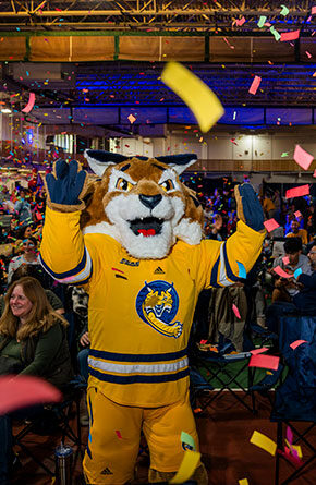 Boomer and members of the Quinnipiac community celebrate the launch of the For the Ambitious Campaign.